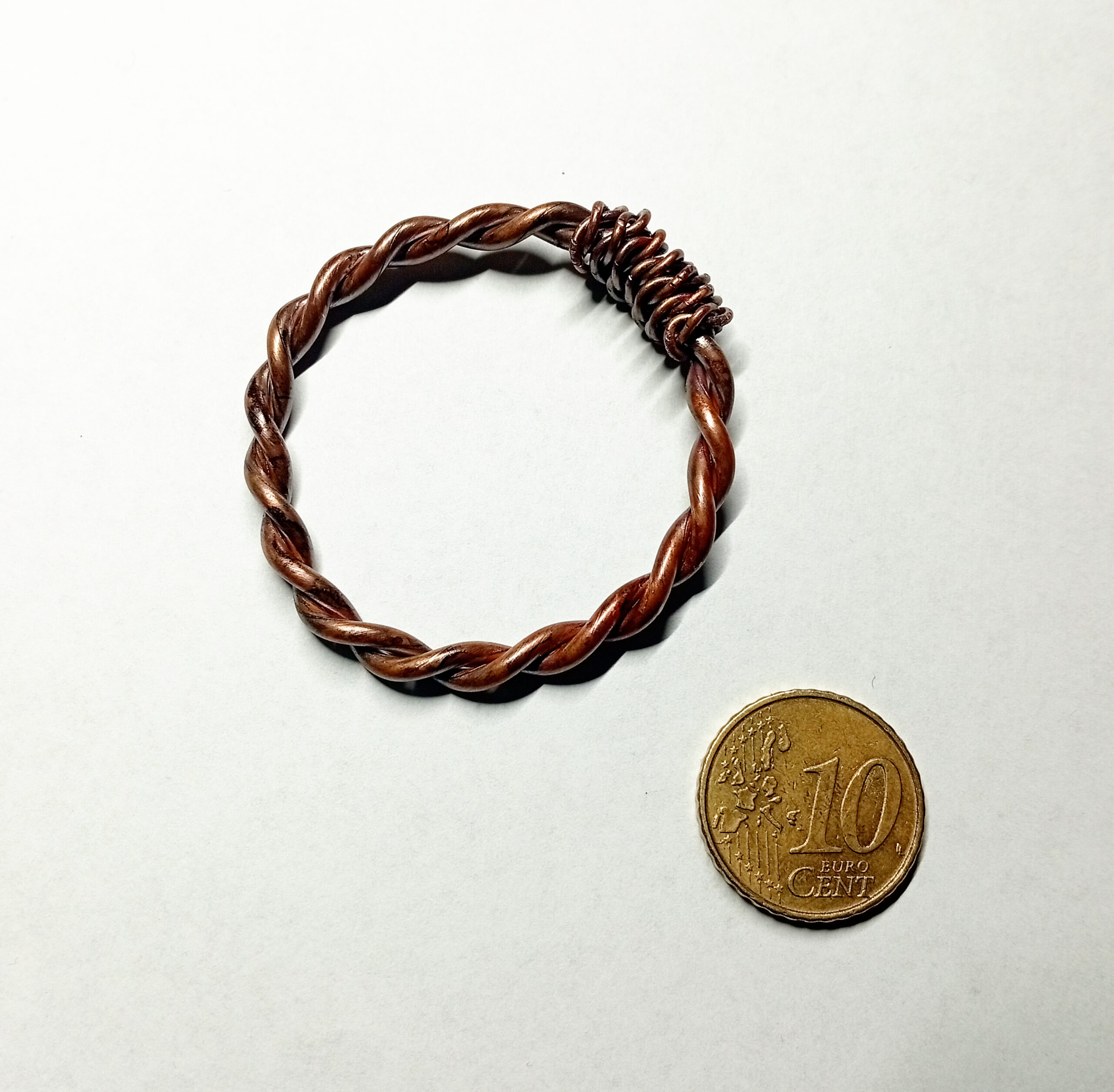 Bronze-Oil copper tensor ring with 10-cent coin for size reference