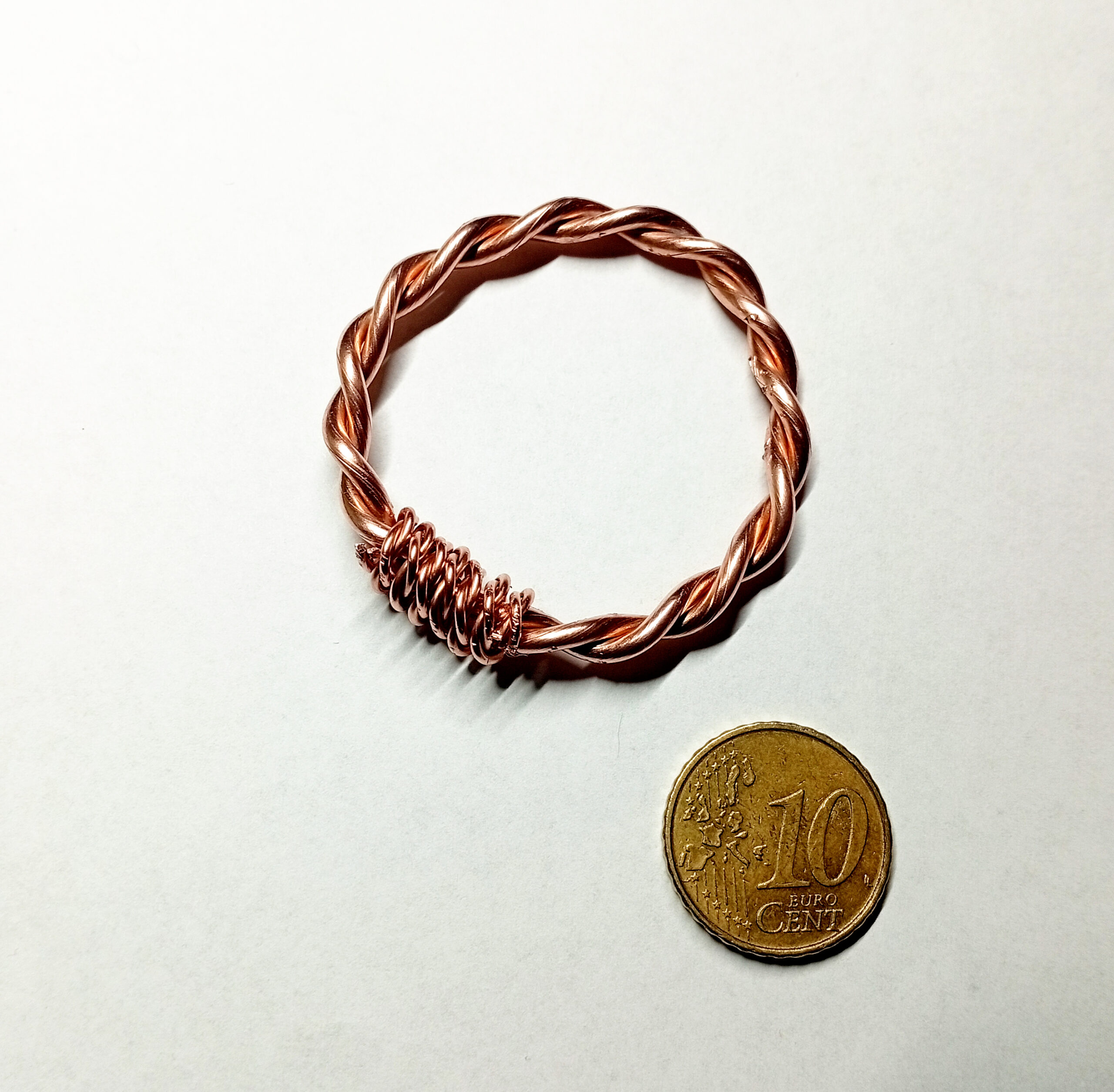 Raw Copper tensor ring with 10-cent coin for size reference
